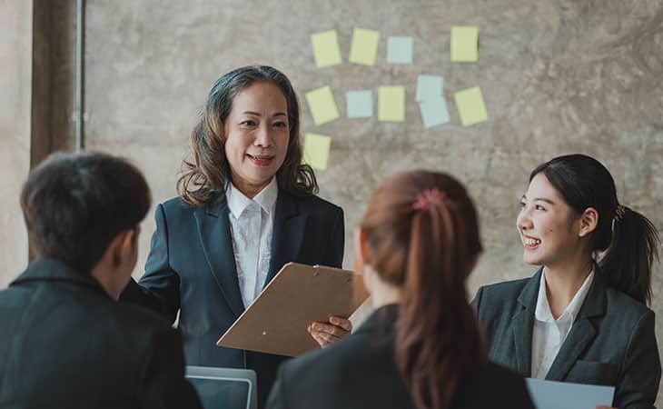 a group of business people in a meeting